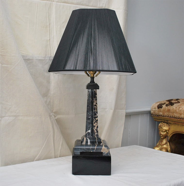 Beautiful well-scaled pair of black marble obelisk lamps on painted black wood bases....newly rewired and with black string shades