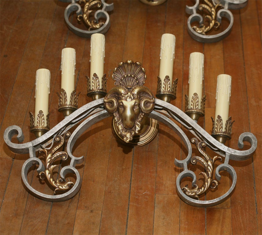 A very nice pair of six-light Baroque style sconces with the frame made of cast zinc and having cast details all made in bronze. These sconces are very dramatic and have a large number of lights in a small compact area.