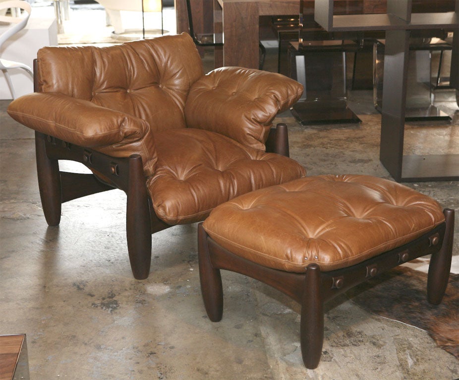 Solid lathed hardwood frame, crossbars allowing for the passage of sole leather straps adjusted with lathed studs forming the membrane for the seat, back, and arm cushions, joined in a single piece.