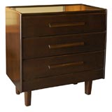 A Three Drawer Ebonized Dresser with Carved Wood Pulls