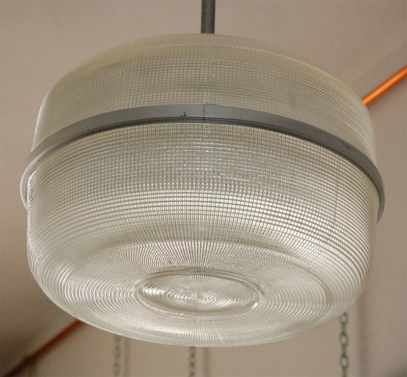 Large molded glass ceiling lights. Oval opening to change the bulb. $6,000 for the set of 4; $3,000 for a pair.