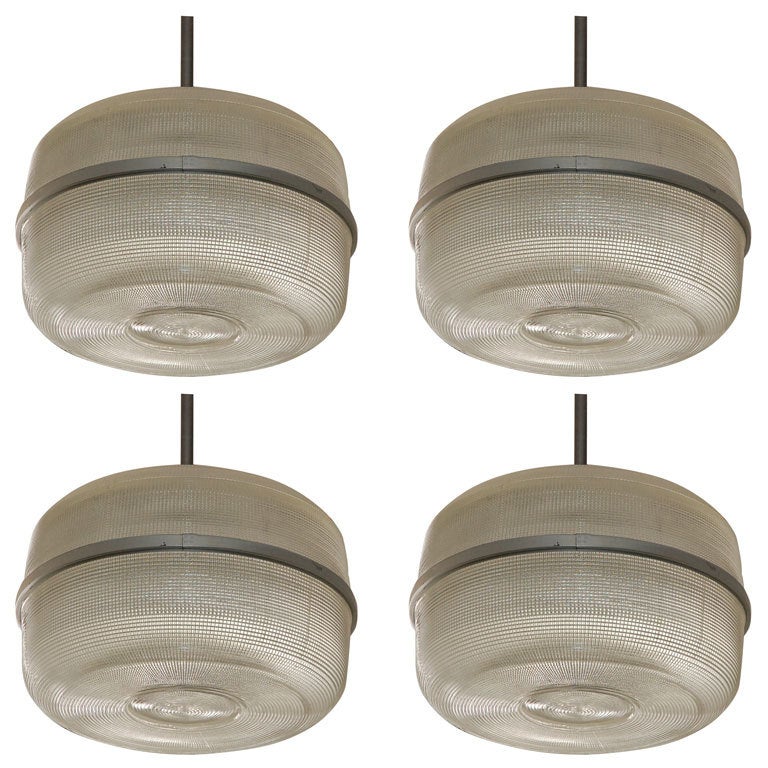 Set of 4 large molded glass industrial hanging lights For Sale at 1stdibs