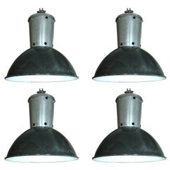 Set of 4 large French industrial enameled hanging lights
