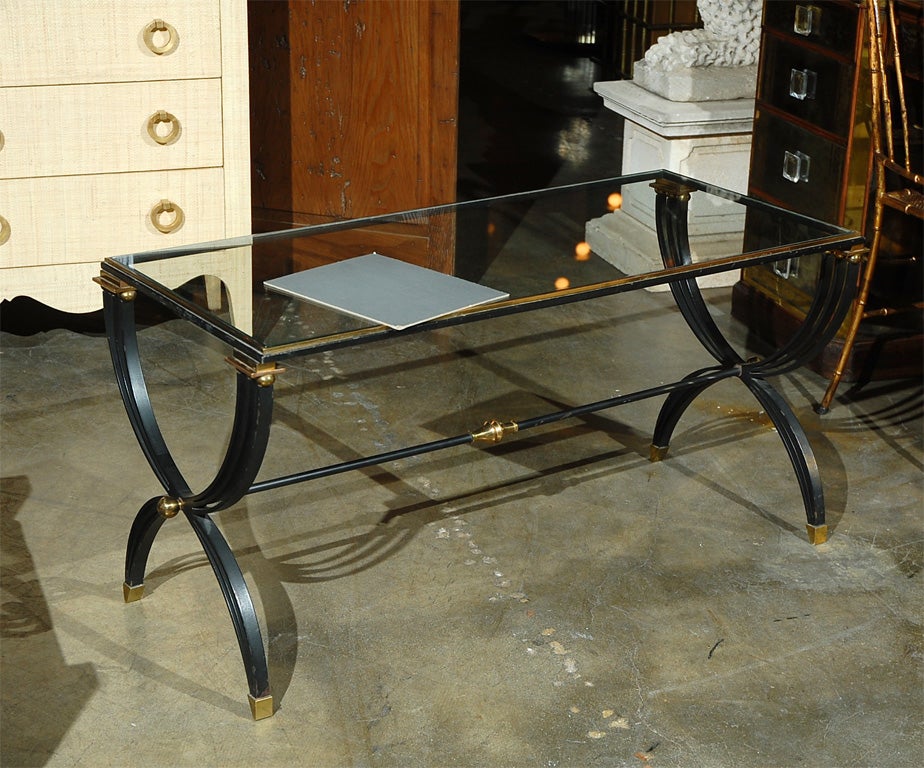 Iron and brass cocktail table attributed to Raymond Subes. 