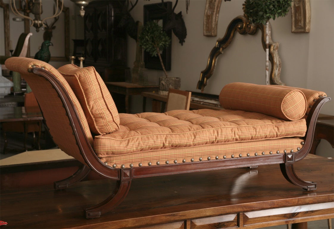Carved frame with upholstered top and cushions