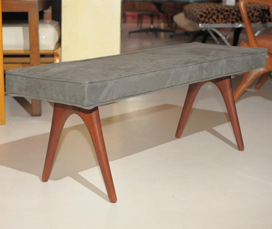 Rare Kagan-Dreyfuss designed organic modern upholstered bench. Black walnut with grey ultra suede.