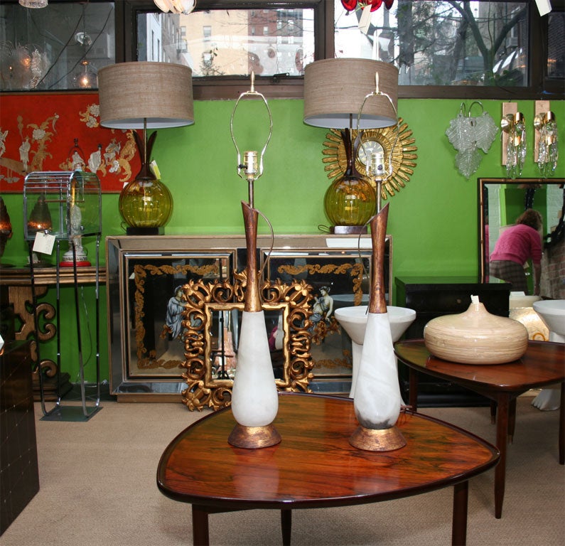 Pair of beautiful alabaster lamps with unique gilt details. Shades are not included.