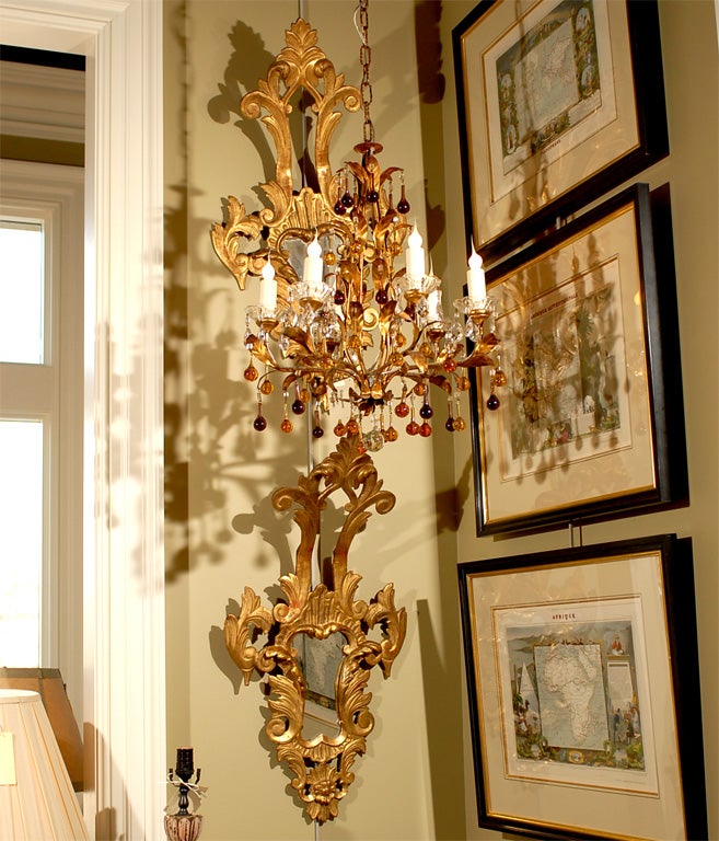 Northern Italian Rococo revival deeply carved gilt wood frames with stylized scallop shells, acanthus leaves and floret design elements with original mirrors