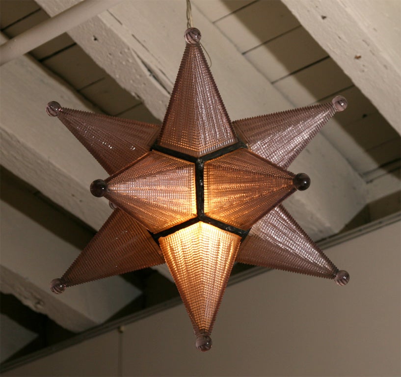 A Pressed Glass Star Formed Ceiling FIxture.