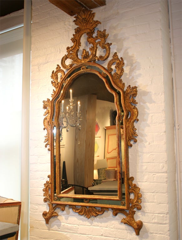 A Carved and Gilded Italian Rococo Style Mirror