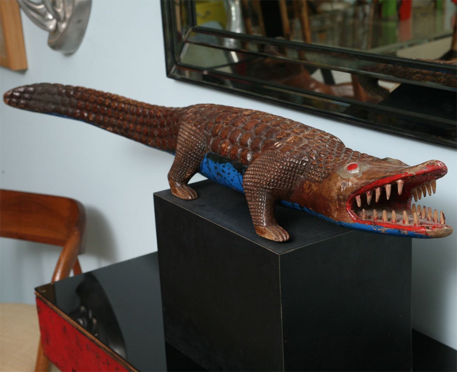 Great folk art wood alligator table sculpture.Incredible detail. Intricate carving to the body. Wonderful patina.