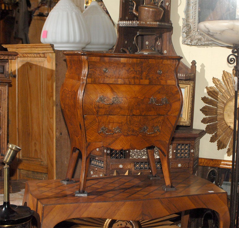 Walnut and walnut burl veneer petite three drawer Italian bombe chest.