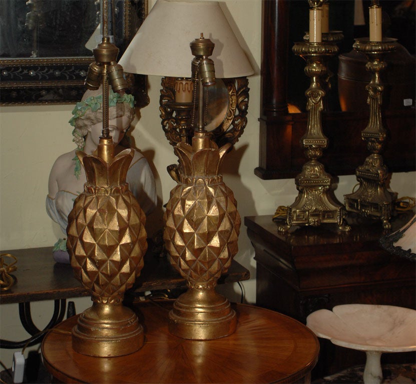 Carved and gold painted wood pineapple form table lamps.