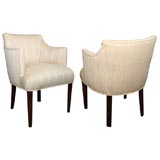 A PAIR OF UPHOLSTERED ARM CHAIRS A PAIR OF UPHOLSTERED ARM CHAIRS