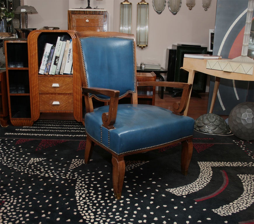 A set of four French Art Deco armchairs by Leleu, in rosewood upholstered with blue/vert leather. Model 2915, circa 1939.