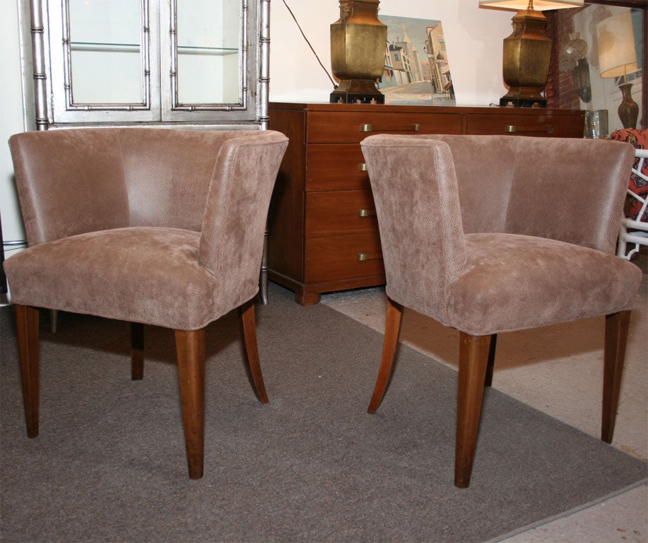 Midcentury tub chair. Covered in faux leather. Some wear.