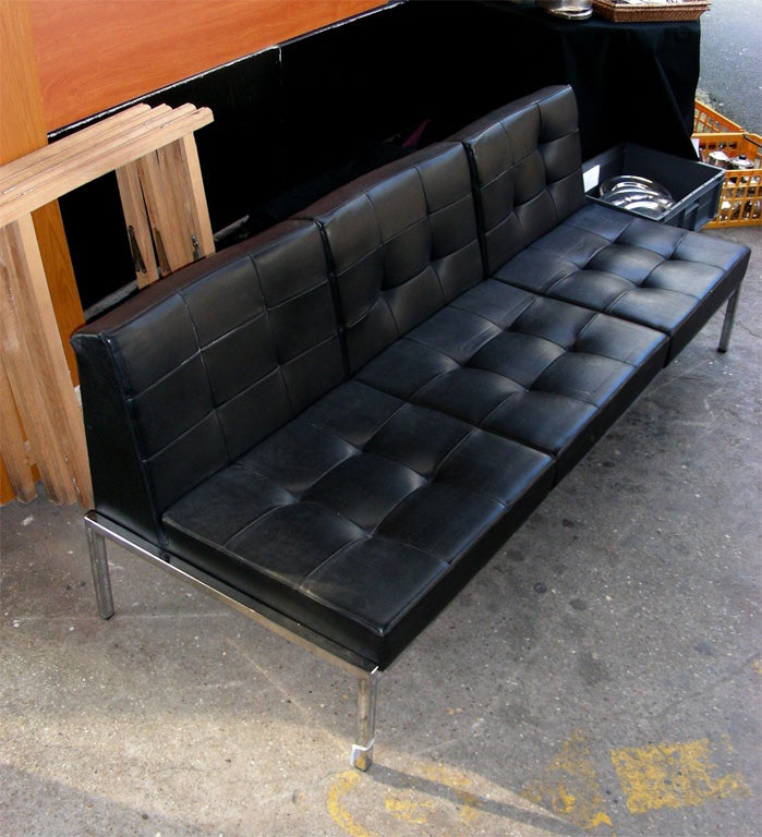 1970s living-room suite edited by Airborn, composed of one three-seater and one two-seater sofas, covered in skaï and leather, with chromed metal base. Two-seather height 68/35 cm., length 127.5 cm., depth 67 cm. Price indicated is for the two, but