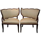 Pair of opposing parlor chairs with scalloped top backs