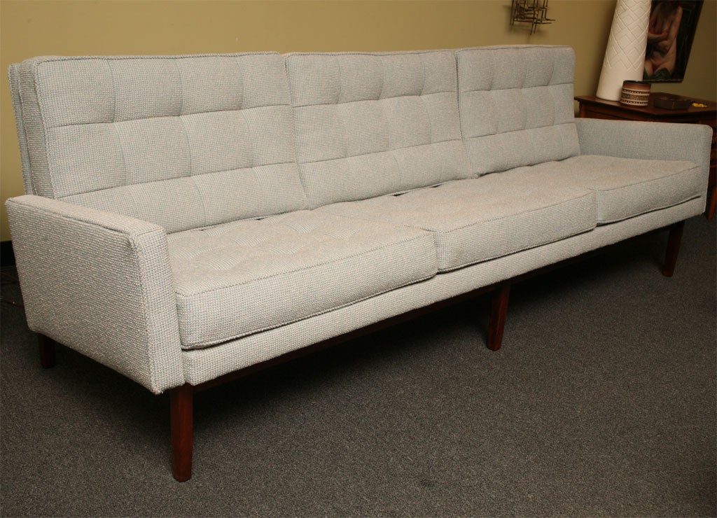 ...SOLD SEPTEMBER 2011...1955 classic Florence Knoll 57W Sofa featuring three seat styling and warm walnut base, legs and back supports.  Refurbished in Knoll fabric.