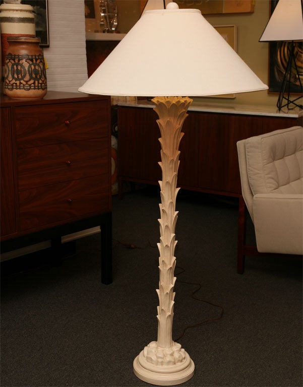 Stunning Dorothy Draper floor lamp with stylised palm trunk motif.  Base with smooth round socle topped with rock forms from which the palm trunk emerges.  French vanilla color.  Very, very good vintage condition.