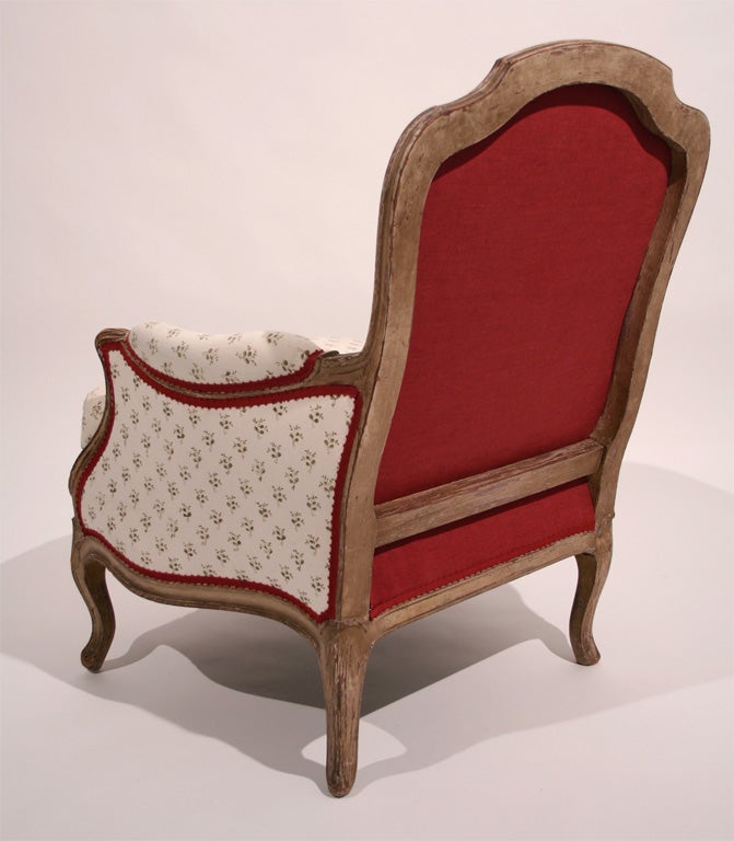 A Pair of Regence Style Bergeres with Indian Moss and Red Fabric