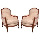 A Pair of Regence Style Bergeres with Indian Moss and Red Fabric