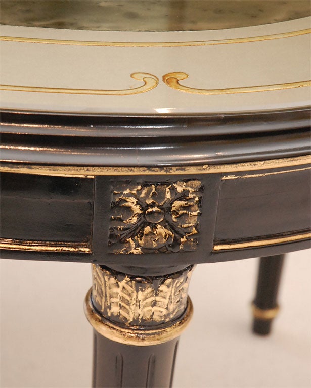Mid-20th Century An Ebonized, Gilt, and Eglomise Oval Dining Table signed Jansen