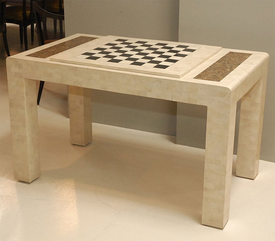 Removeable chess top with a  backgammon board below.  Drawers for game pieces.