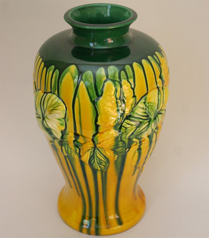 Brilliant yellow ground, slightly iridescent, with strong emerald green drip from shoulder to foot.  Hand thrown, with  applied decoration. Impressed export and Sanpei kiln mark.