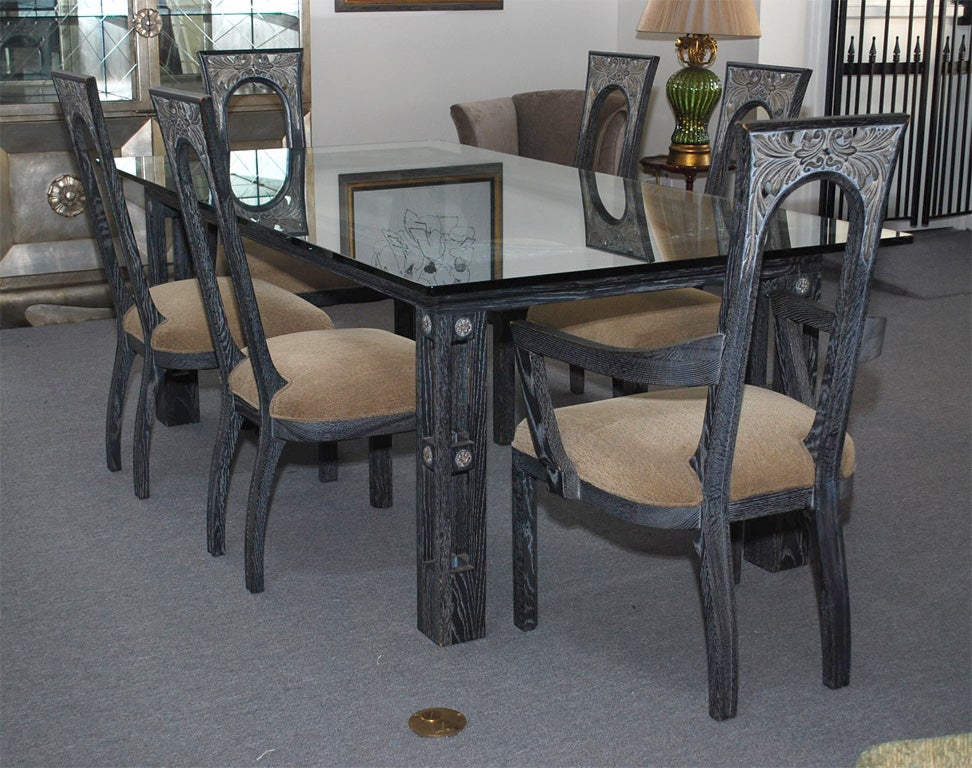 Exquisite Art Deco influenced dining set by JAMES MONT. The cerused oak set consists of six chairs (2 Arm and 4 Side chairs)    and has beautiful carved detailing which is followed through on to the dining table which has a 7 foot 3/4