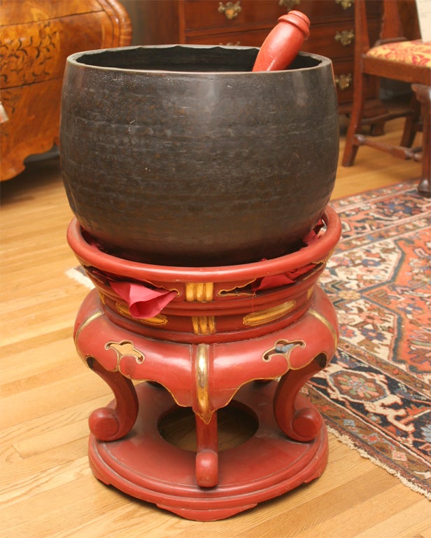 Japanese Bronze Temple Gong with the original red lacquer stand and<br />
striking mallet, has a remarkable quite long resonating sound.