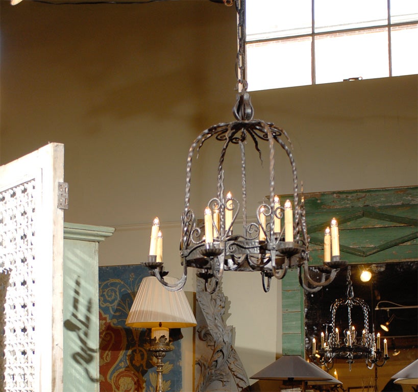 19th century Italian hand forged domed iron twelve-light chandelier, rewired for USA.