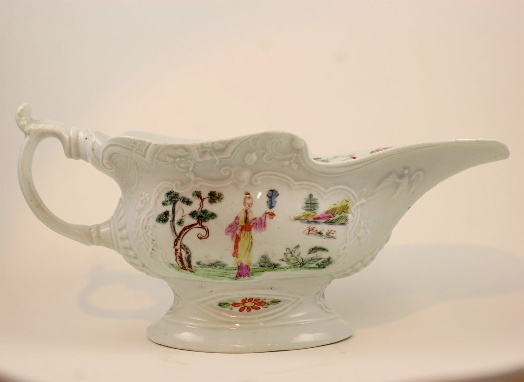 A rare and fine First Period Worcester porcelain silver shape sauceboat painted with Oriental figures and flowers