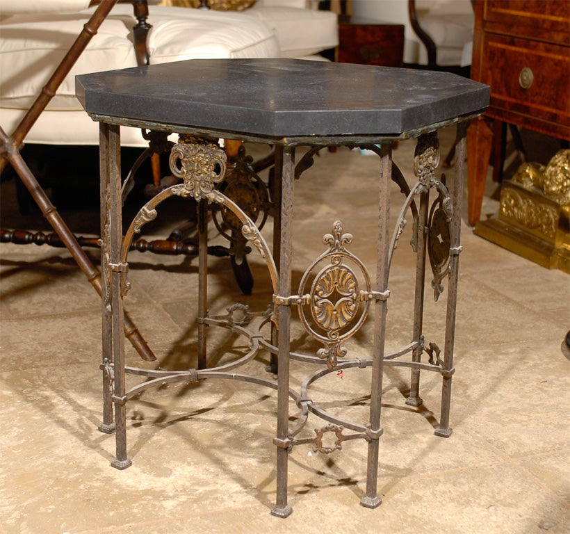 Iron and bronze table with black marble top attributed to Oscar Bach
Heavy.