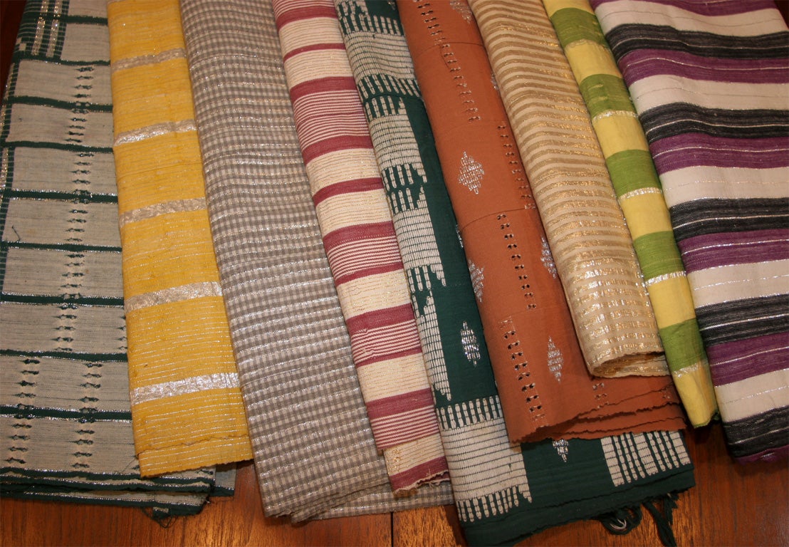 Collection Nigerian Yoruba, Aso-oke Fabric, Natural cotton with silver lurex, Sold individually.<br />
From left to right in main image:<br />
Forest green/cream/lurex (2 identical pieces available) 50” X 80”<br />
<br />
Yellow stripe, 24” X