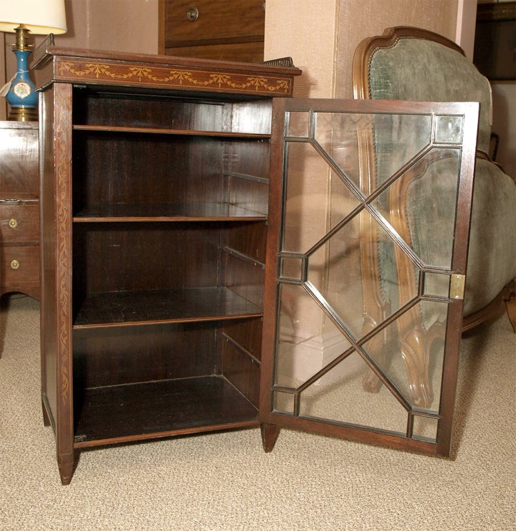 Small inlaid antique English mahogany bookcase. at 1stDibs