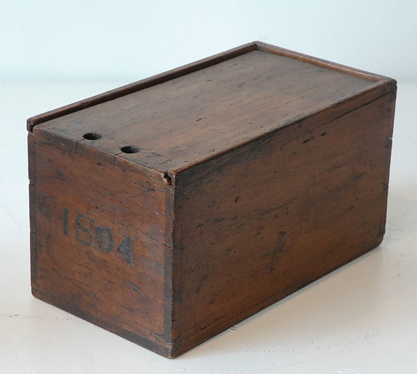 19TH C. CANDLE BOX DATED 1804 WITH ORIGINAL SLIDE TOP, DOVE TAILED CONSTRUCTION WITH ORIGINAL SURFACE.