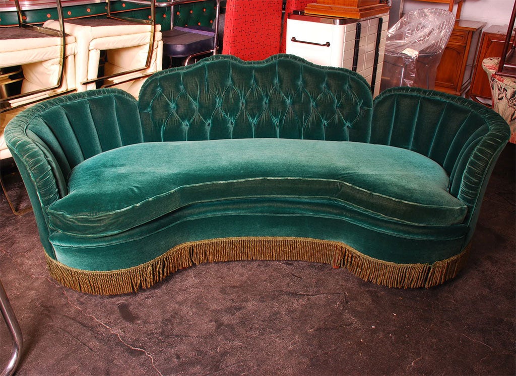 This remarkable sofa is a pristine example of early 20th Century American design influenced by French Art Deco.