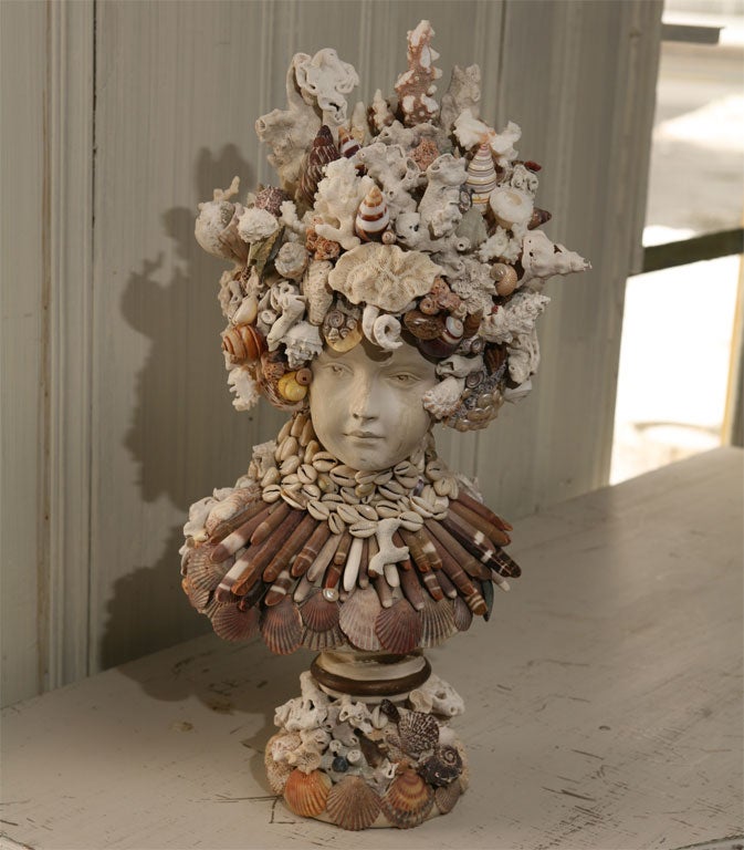 A tribute to the ocean is reflected in the classical vintage plaster bust adorned with seashells and coral.