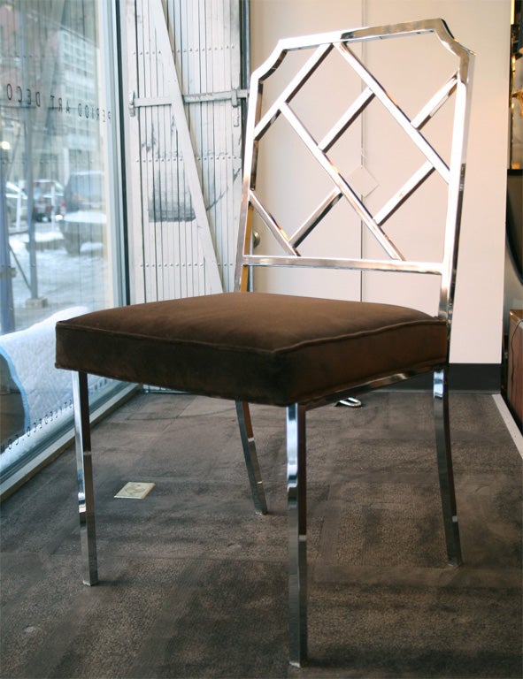 Chrome chippendale style chairs.<br />
Set includes two arm and two<br />
side chairs, and have been<br />
newly upholstered in brown<br />
velvet.  The side chairs<br />
measure 19.5