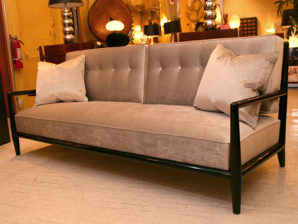 Very elegant sofa with grey shimmery velvet upholstery. The frame is stained a deep espresso color. Please contact for location.