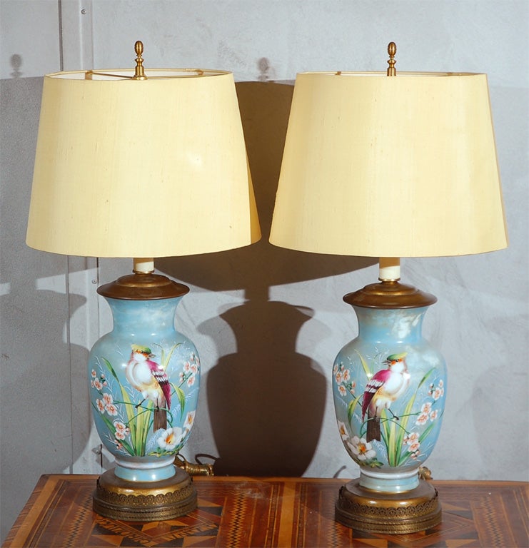 A nice pair of decorated table lamps, English, circa 1910. This pair would be well suited in any number of settings. Good quality, good condition, nicely decorated, just add to your setting of choice. New silk shades.
