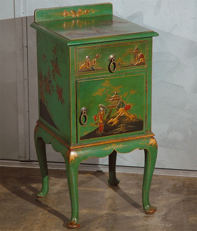 This nicely decorated chinoiserie cupboard would be a hit in any number of settings. Purchased in England it appears to be from an earlier part of the last century. It has one drawer and one door, both have oriental style brass handles. 