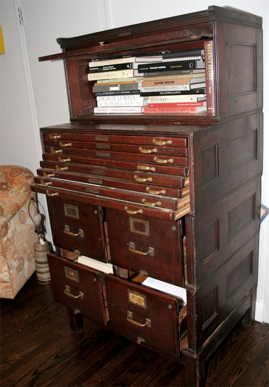 Mahogany stacking file cabinet with four file cabinets, ten flat files and one glass covered book shelf.