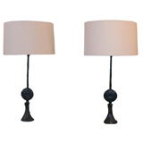 A pair of bronze lamps stamped  "RL"