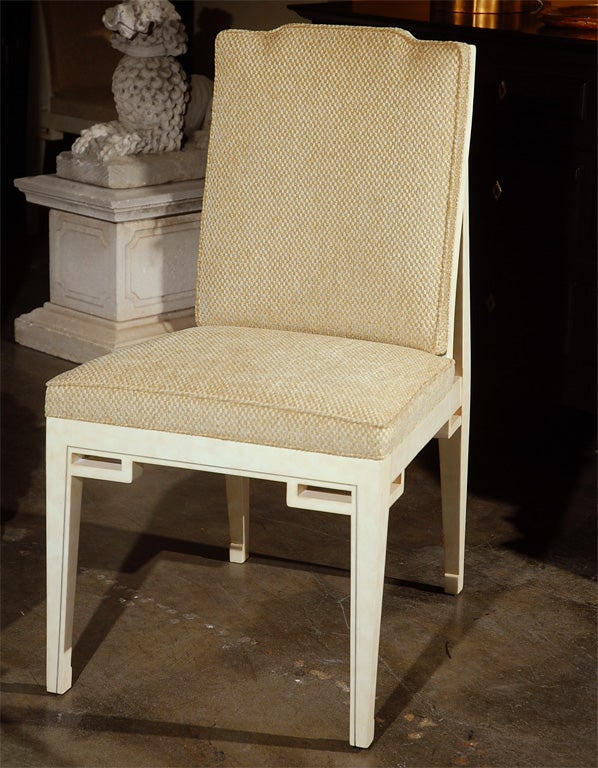 Mid-Century set of six reupholstered dining chairs refinished in faux parchment.