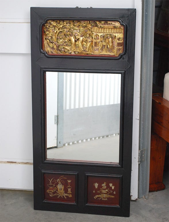 Late 19th century Q'ing Dynasty carved and lacquered panel with mirror inset.