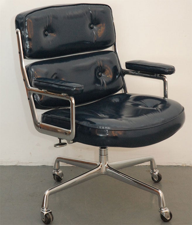 Classic office chair, from the Time Life building in New York. Designed by Charles and Ray Eames. Newly upholstered in navy patent leather with perfectly polished aluminum base. Multiple quantity available and may be reupholstered in any leather.