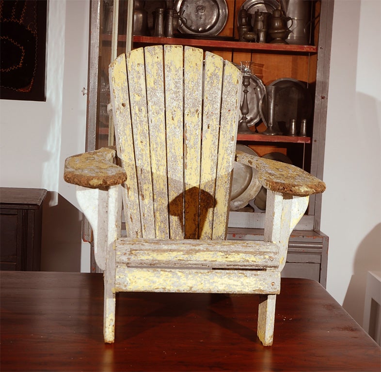 1930'S CHILD'S ADIRONDACK CHAIR IN ORIGINAL PAINT / WHITE OVER YELLOW IN GREAT CONDITION.  PERFECT SIZE.