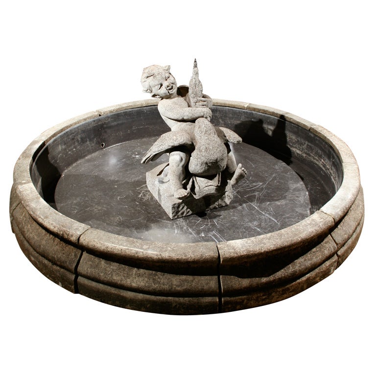 French cast stone fountain of a boy on a goose For Sale